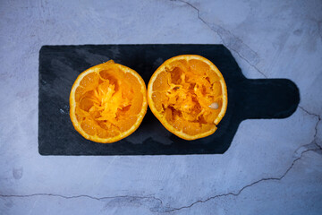 Orange cut in half and squeezed