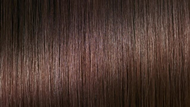 Hair texture | A stick running under brunette hair surface making wave | Anti dandruff concept