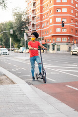 Afro American Boy Riding Electrical Scooter