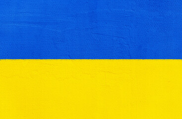 Colors of the national ukrainian flag. Ukrainian concept. Yellow and blue background with copy space for your text. Template or wallpaper with wall texture for design.