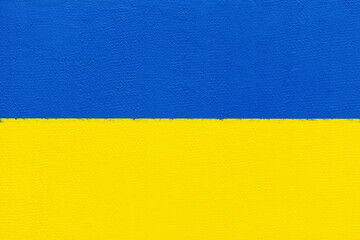 Ukrainian concept. Colors of the national ukrainian flag. Yellow and blue background with copy space for your text. Template or wallpaper with wall texture for design.