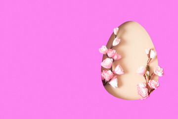 Paper cut Easter egg with cherry blossom branch. Easter holiday concept with copy space