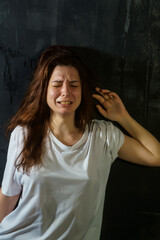 portrait of a young woman with emotions suffering, sadness, pain, depression, mental disorders, psychology 