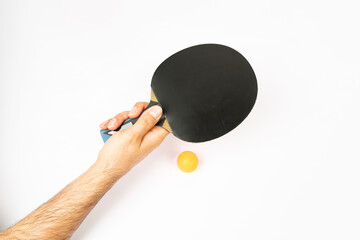 table tennis racket and ping pong balls on a white background
