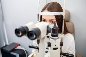 An optometrist at his clinic studies vision. Ophthalmology, medical diagnostics.