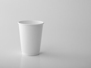 White takeaway paper cup on white background.