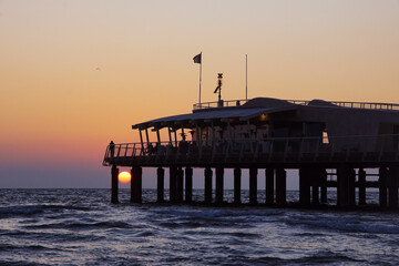 Fototapeta premium pier in the sunset at lido di camaiore in versilia