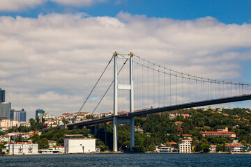 Ferries passing by Bosporus with blue sky and clouds. Istanbul Bosporus Bridge on day time