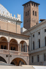 Fototapeta na wymiar Padova. Piazza delle Erbe. Dettaglio del Palazzo della Ragione con Municipio verso la Torre degli Anziani