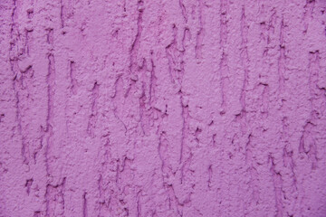 Background surface with the texture of pink plaster. Old cement horizontal wall.
