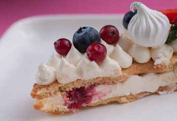 cake in the form of the number eight for the holiday with cream and strawberries rosemary blueberries and marshmallows	