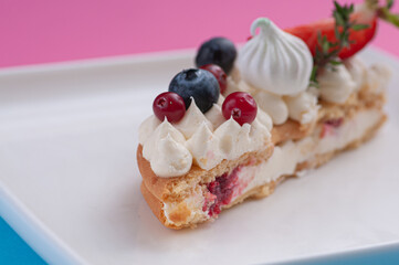 cake in the form of the number eight for the holiday with cream and strawberries rosemary blueberries and marshmallows	