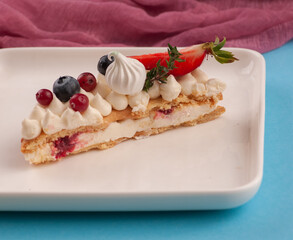 cake in the form of the number eight for the holiday with cream and strawberries rosemary blueberries and marshmallows	
