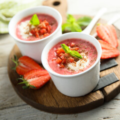 Homemade strawberry soup with chocolate and cream