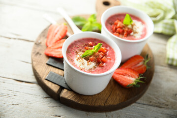 Homemade strawberry soup with chocolate and cream