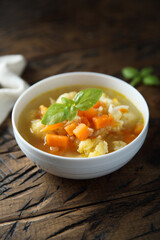 Homemade cauliflower soup with fresh basil