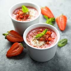 Homemade strawberry soup with chocolate and cream