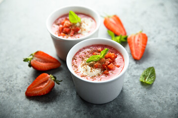 Homemade strawberry soup with chocolate and cream