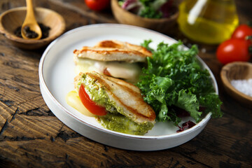 Chicken stuffed with pesto, tomato and cheese