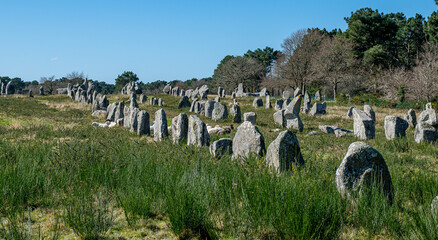 Carnac, France; February 26, 2022: Alignment of Neolithic menhirs of Ménec, a site located in Morbihan in Brittany, the town is known for its alignments of 2,934 menhirs.
