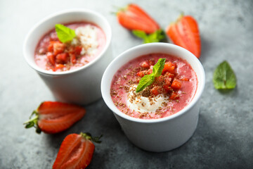 Homemade strawberry soup with chocolate and cream