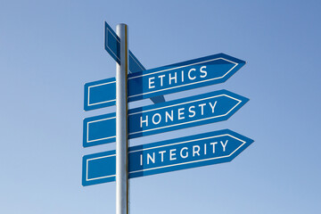 Ethics honesty integrity words on signpost isolated on sky background - obrazy, fototapety, plakaty