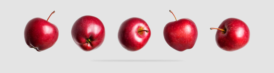 Red fresh apples isolated on light gray background. Whole ripe apples. Sweet summer fruit, organic natural apple. Apple set for design and advertising. Concept of food and harvest