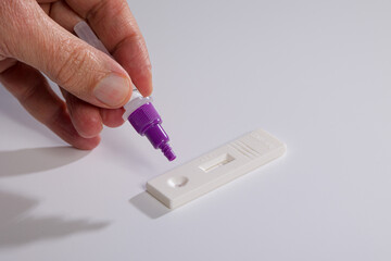 Close-up of preparing antigen self-test or quick test for Corona or Covid-19
