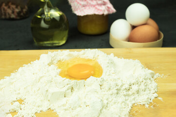 Fresh and raw chicken egg in flour