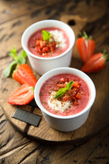 Homemade strawberry soup with chocolate and cream