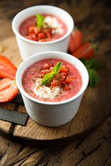 Homemade strawberry soup with chocolate and cream