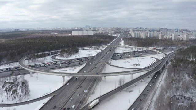Landscape with traffic at the junction of the ring road on a sunny winter day.