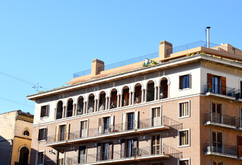 Naklejka premium Facade of a building. Residential building with balconies. Colorful buildings and hotel apartments. Facade of residential building in Spain. House with window and balcony. Buildings architecture 