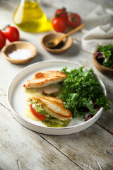 Chicken stuffed with pesto, tomato and cheese