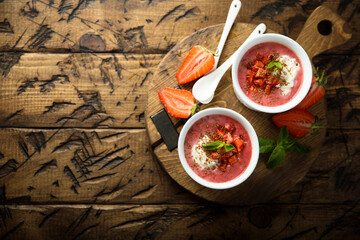 Homemade strawberry soup with chocolate and cream