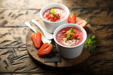 Homemade strawberry soup with chocolate and cream