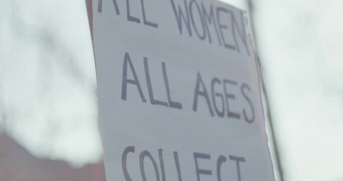Protester carry sign equal rights wages women&rsquo;s day protest close up