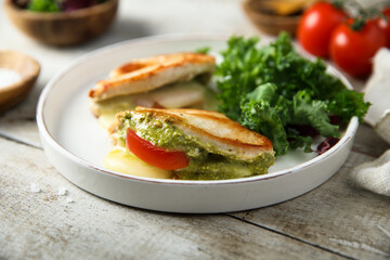 Chicken stuffed with pesto, tomato and cheese