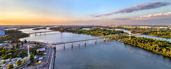 Aerial panorama of the Dnieper with the Petrovsky Railway Bridge in Kiev, the capital of Ukraine, before the war with Russia © Leonid Andronov