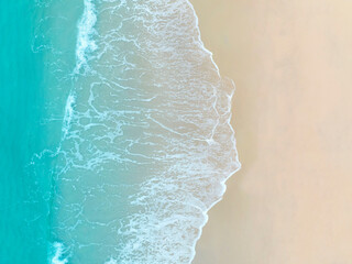 Aerial view Perspective of Waves and Beach from top view. Blue water background by drone.