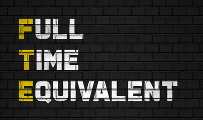 Fototapeta premium Full time equivalent (FTE) concept,business abbreviations on black wall 