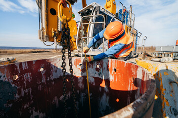 Workers start construction of a concrete bridge 
