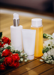 mockup of beauty fashion cosmetic makeup bottle serum dropper product with skincare with flowers .healthcare concept