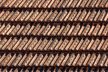 Red Roof tiles. Tile roof of a old house. Tile roofs used in old and modern style construction.