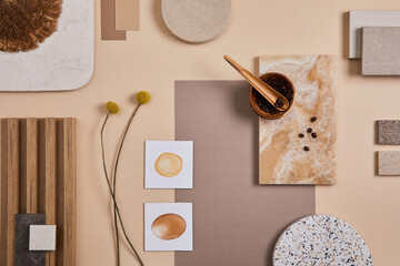 Flat lay of stylish architect moodboard composition with beige samples of textile, paint, wooden...
