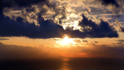 Naklejka na ściany i meble Beautiful sunset with clouds and sea