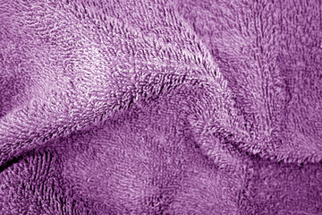 Fototapeta na wymiar Bath towel texture in purple color.