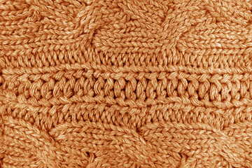Warm knitting texture in orange color.