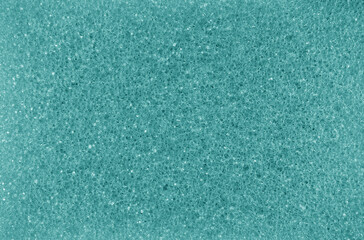 Cleaning sponge texture in cyan tone.