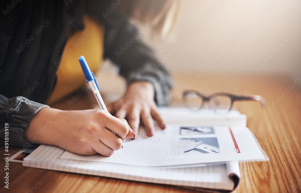 Poster Her study methods are take notes. Cropped shot of an unrecognizable female university student in class.